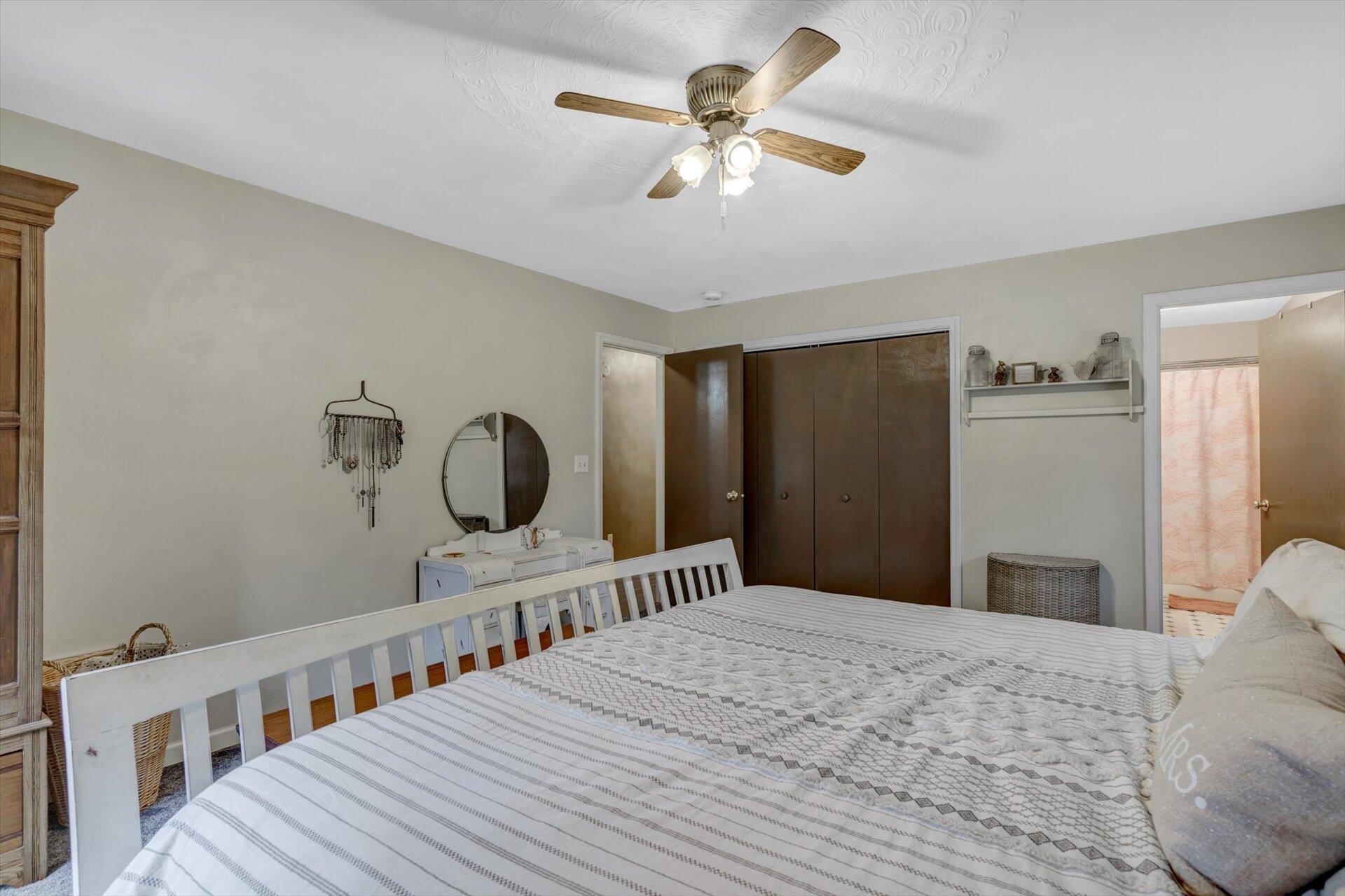 415 Eton Road Hardy, VA 24101 - Photo 28 of 44 a bedroom with a bed a large window and dresser