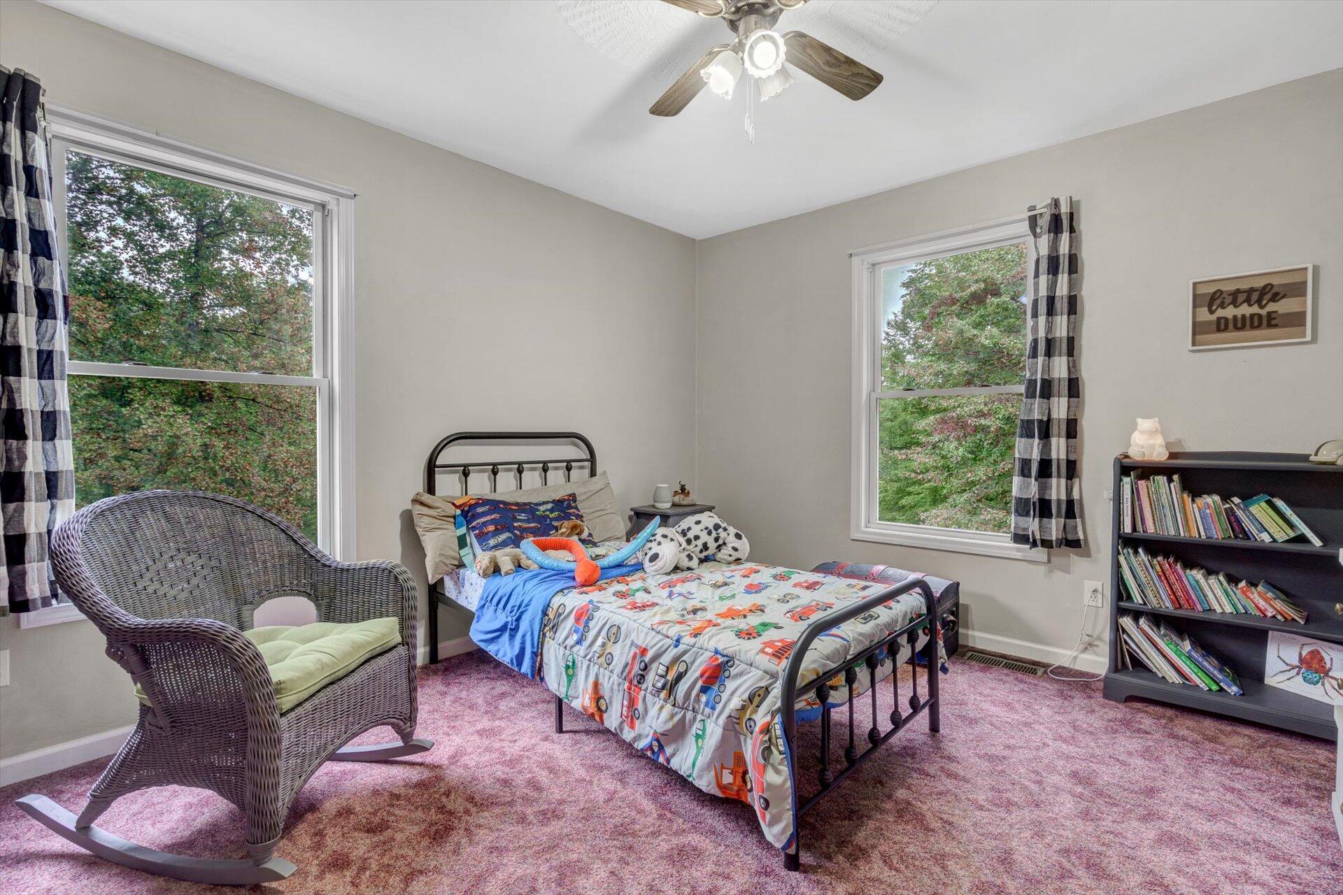 415 Eton Road Hardy, VA 24101 - Photo 30 of 44 a bedroom with a bed and a book shelf