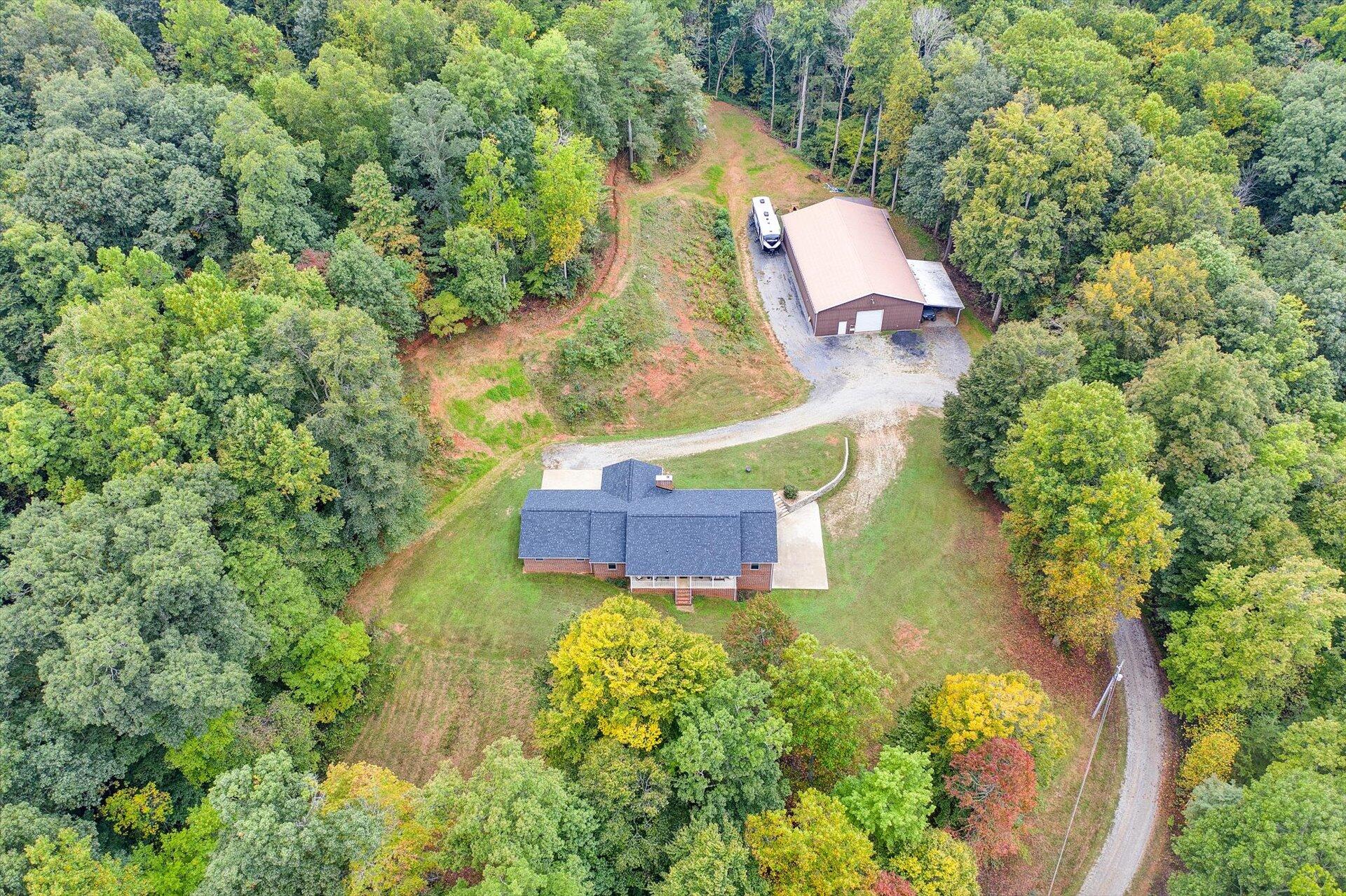 415 Eton Road Hardy, VA 24101 - Photo 4 of 44 an aerial view of a house with a yard and trees all around