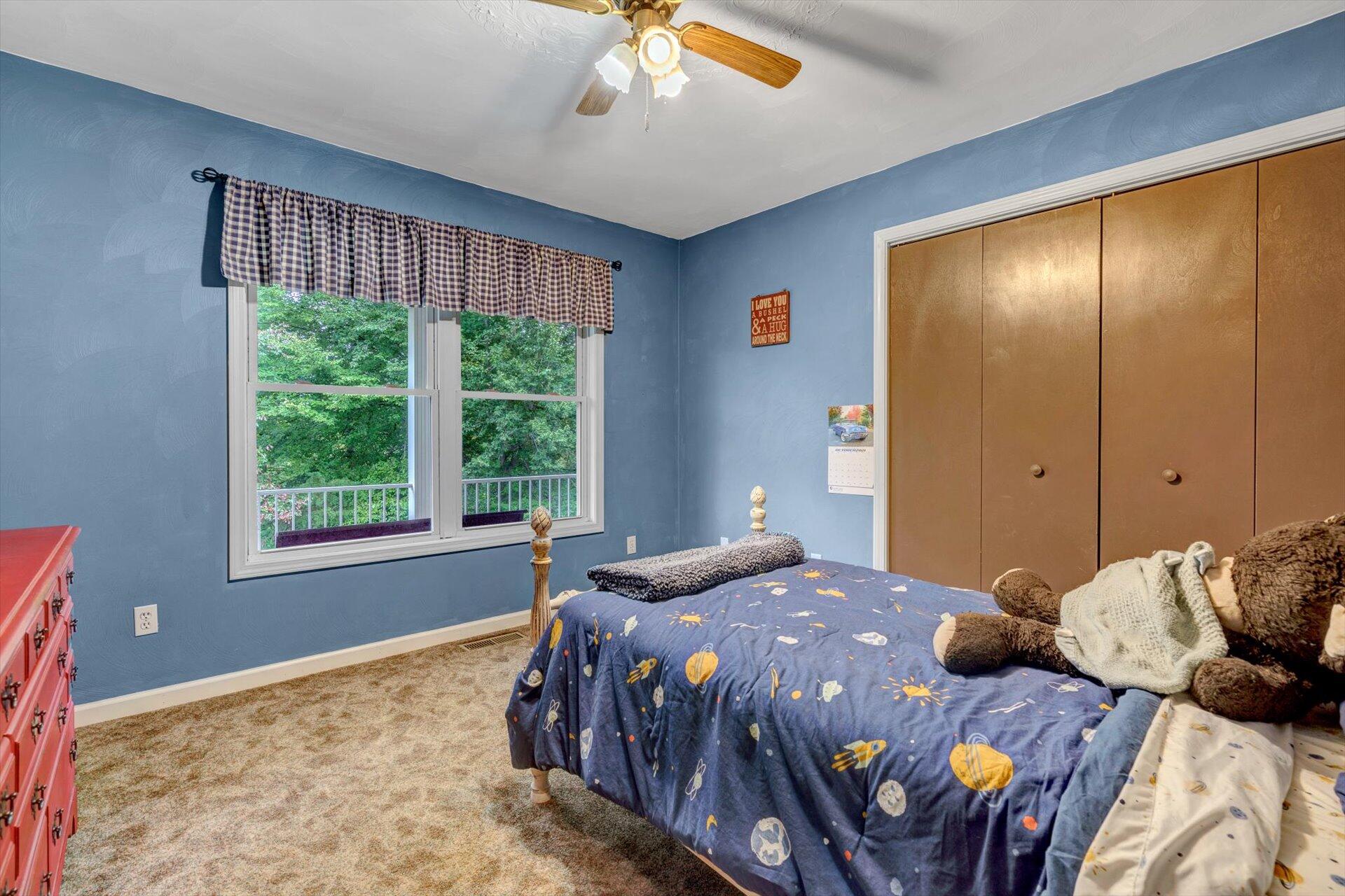 415 Eton Road Hardy, VA 24101 - Photo 31 of 44 a bedroom with a bed and a window