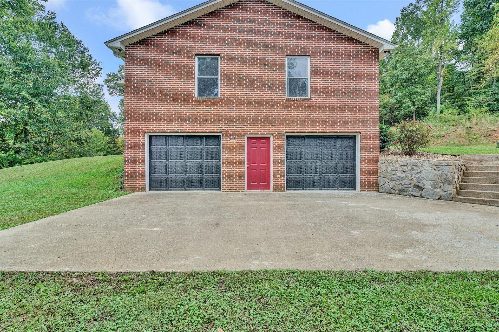 415 Eton Road Hardy, VA 24101 - Photo 34 of 44 a front view of a house with a yard and garage