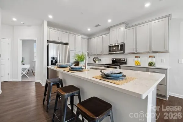 a spacious bedroom with a bed and window