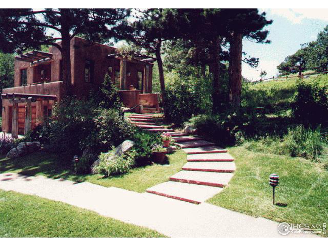 136 Old Post Office Road Boulder, CO 80302 - Photo 11 of 11 a view of a house with a yard and garden