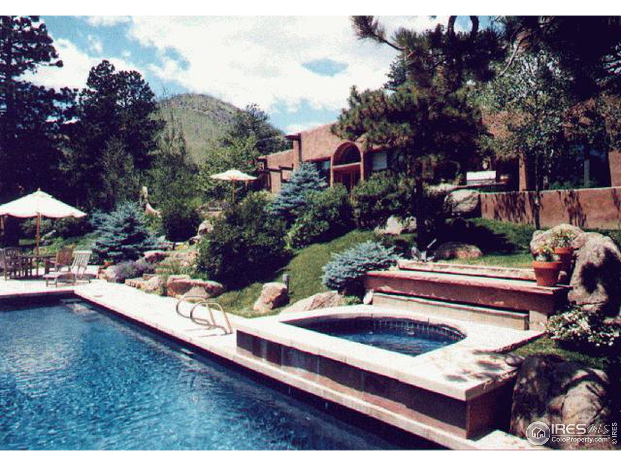 136 Old Post Office Road Boulder, CO 80302 - Photo 3 of 11 a view of a backyard with sitting area and furniture