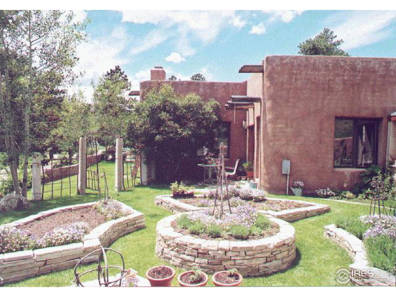 136 Old Post Office Road Boulder, CO 80302 - Photo 5 of 11 a swimming pool with outdoor seating and yard