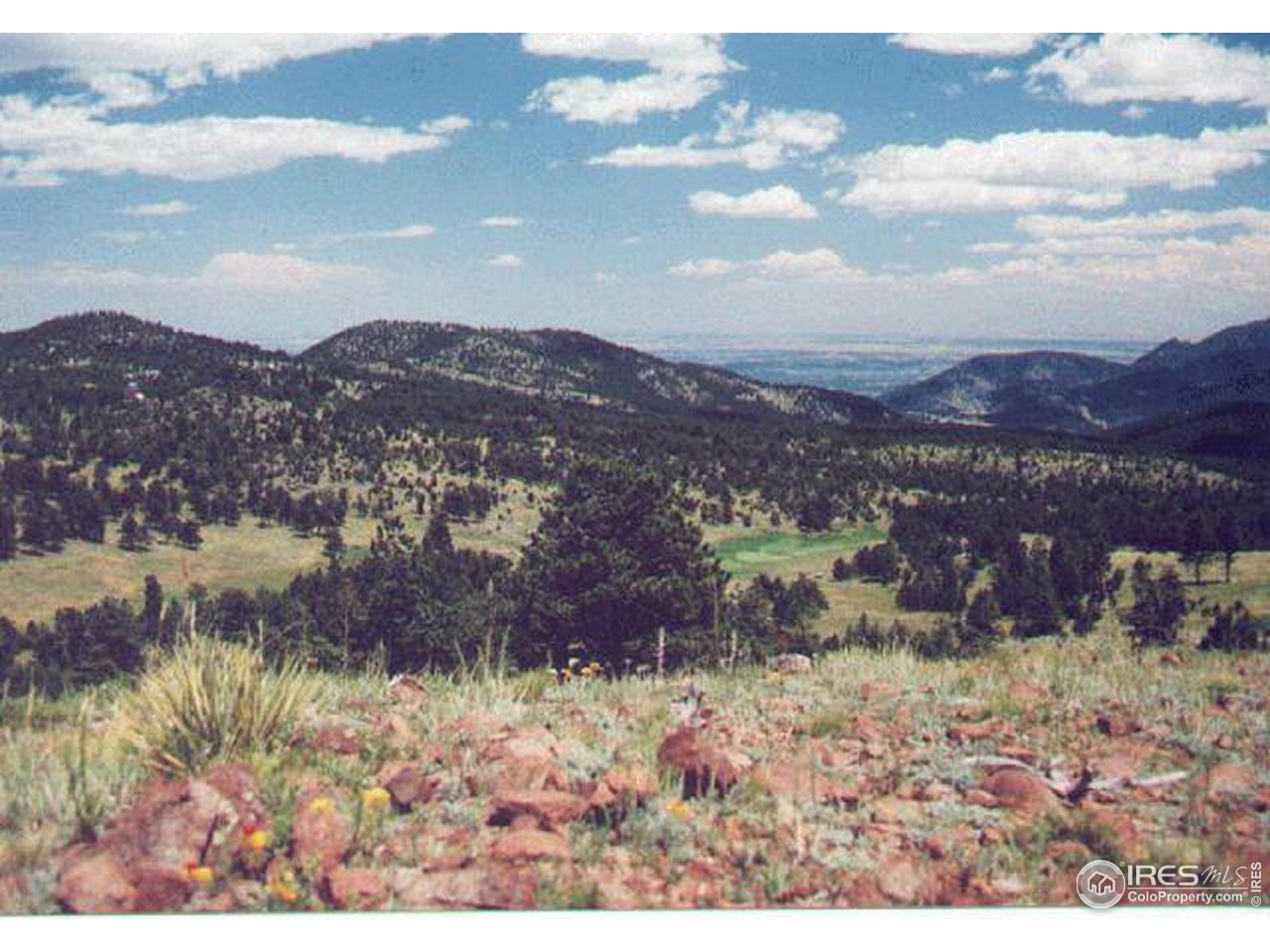 136 Old Post Office Road Boulder, CO 80302 - Photo 6 of 11 a view of a lake with mountains in the background
