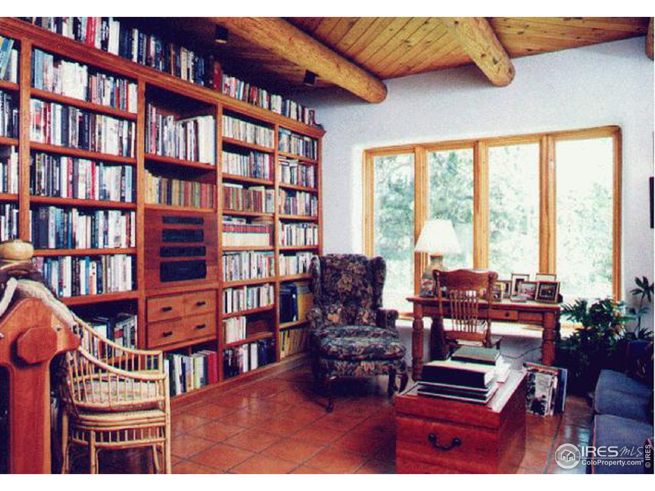 136 Old Post Office Road Boulder, CO 80302 - Photo 10 of 11 a living room with furniture a bookshelf and a window
