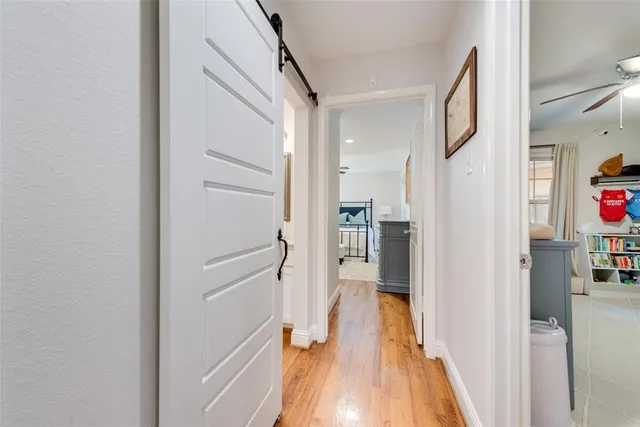 a kitchen with granite countertop kitchen island stainless steel appliances a sink stove and cabinets