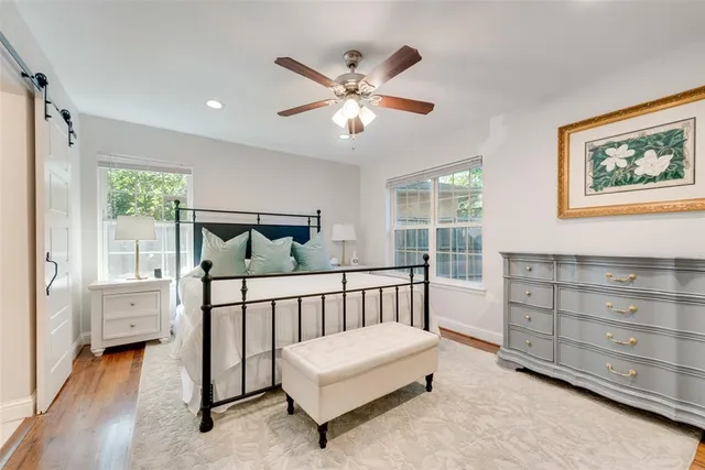 a bedroom with furniture and flat screen tv