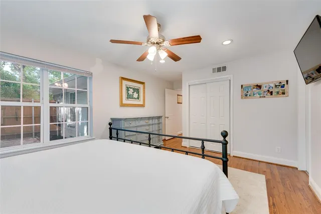 a bedroom with furniture and window