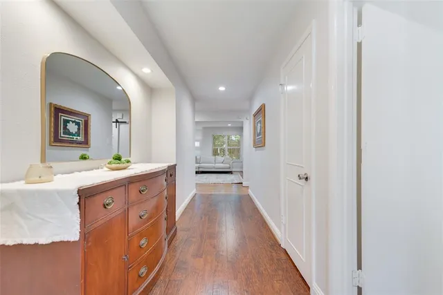 a spacious bathroom with a double vanity sink and a mirror