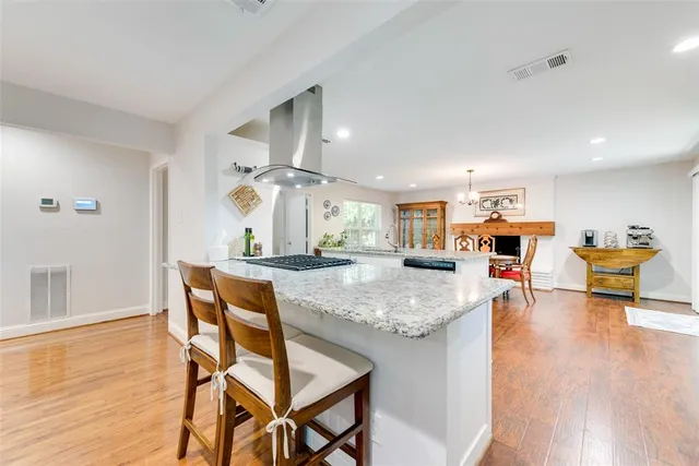 a view of kitchen and dining room with wooden floor