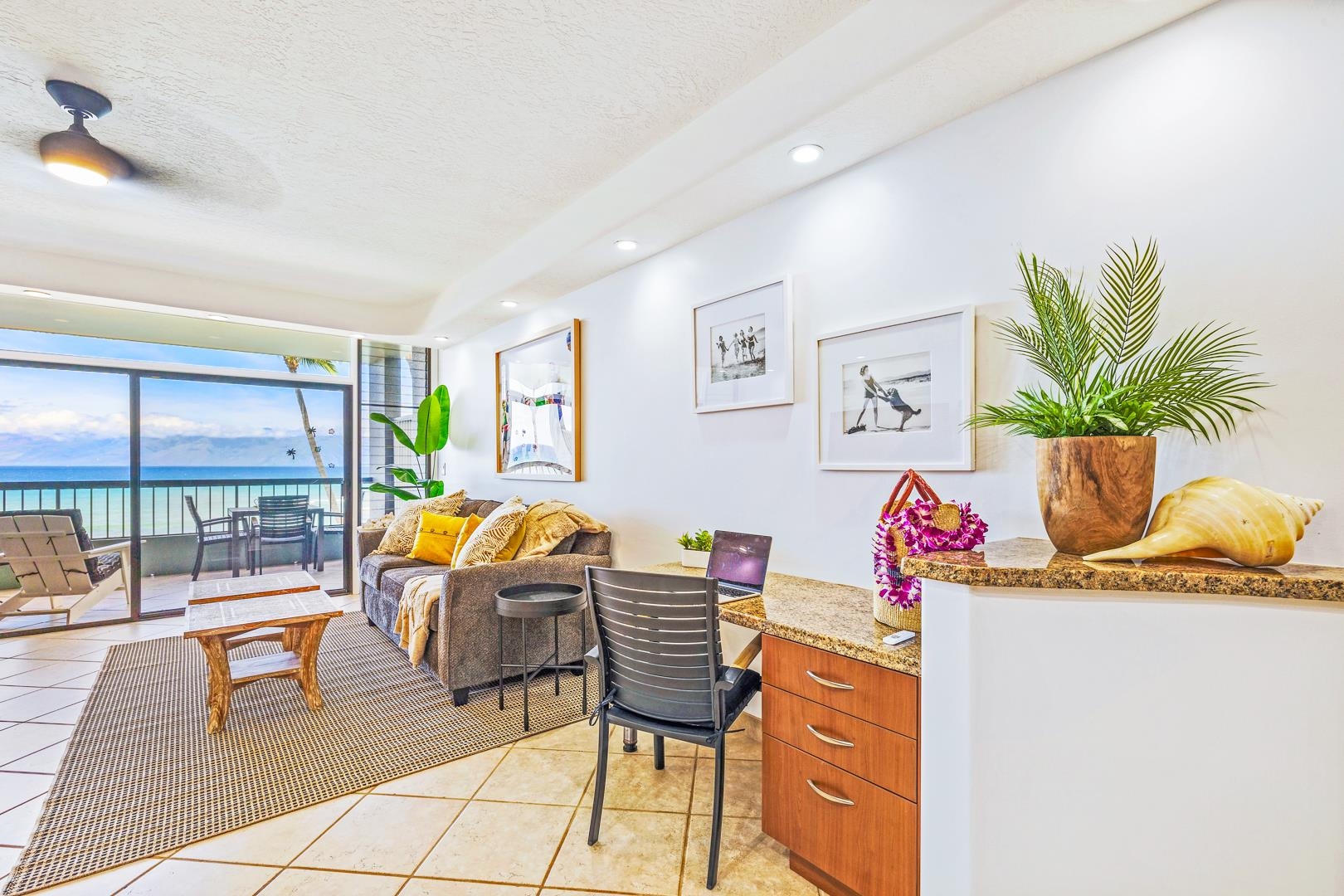 3875 Lower Honoapiilani Road, Unit B305 Lahaina, HI 96761 - Photo 17 of 35 a living room with furniture and a floor to ceiling window