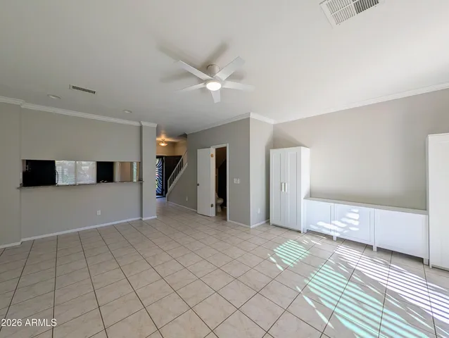 a view of an empty room with a window
