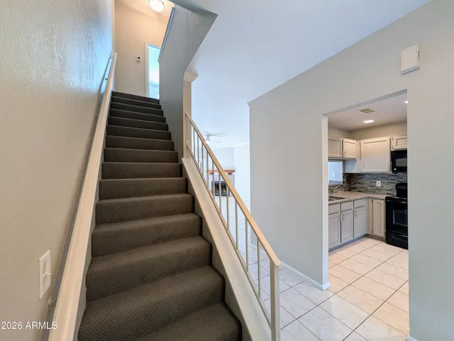 a view of a kitchen with microwave and stove top oven