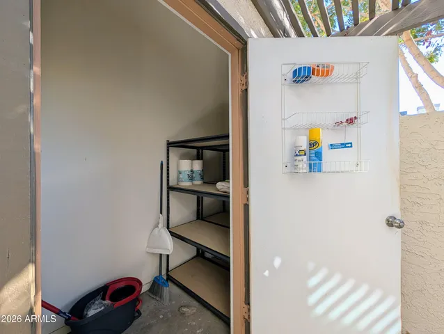a view of storage and utility room with empty racks