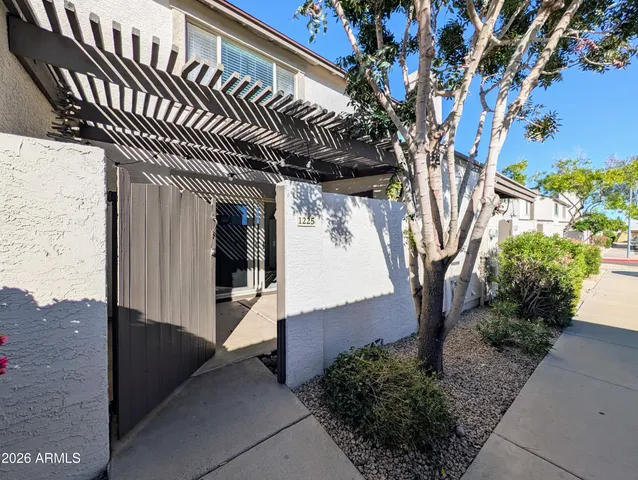 a view of a house with a tree