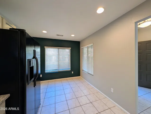 a view of an empty room with a fireplace
