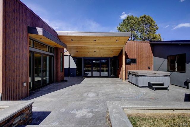 a view of a porch with furniture and a tub
