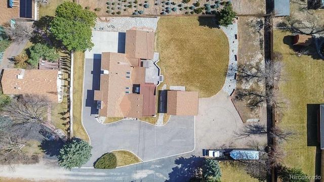 an aerial view of a house with outdoor space