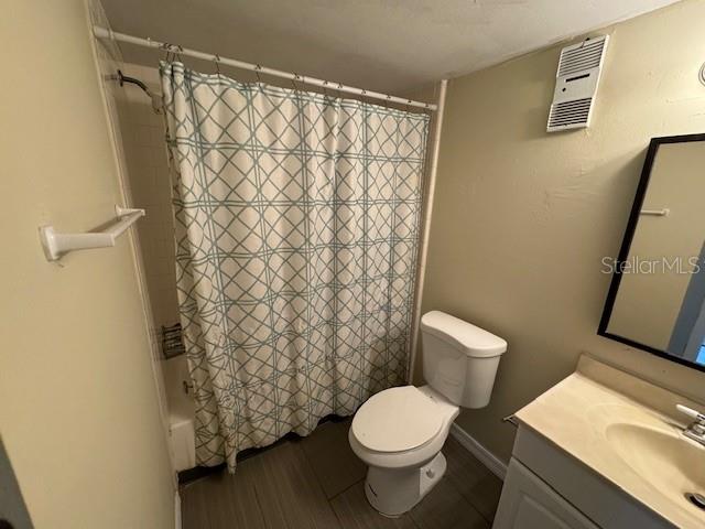 922 Lake Destiny Road, Unit F Altamonte Springs, FL 32714 - Photo 12 of 20 a white toilet sitting next to a shower curtain