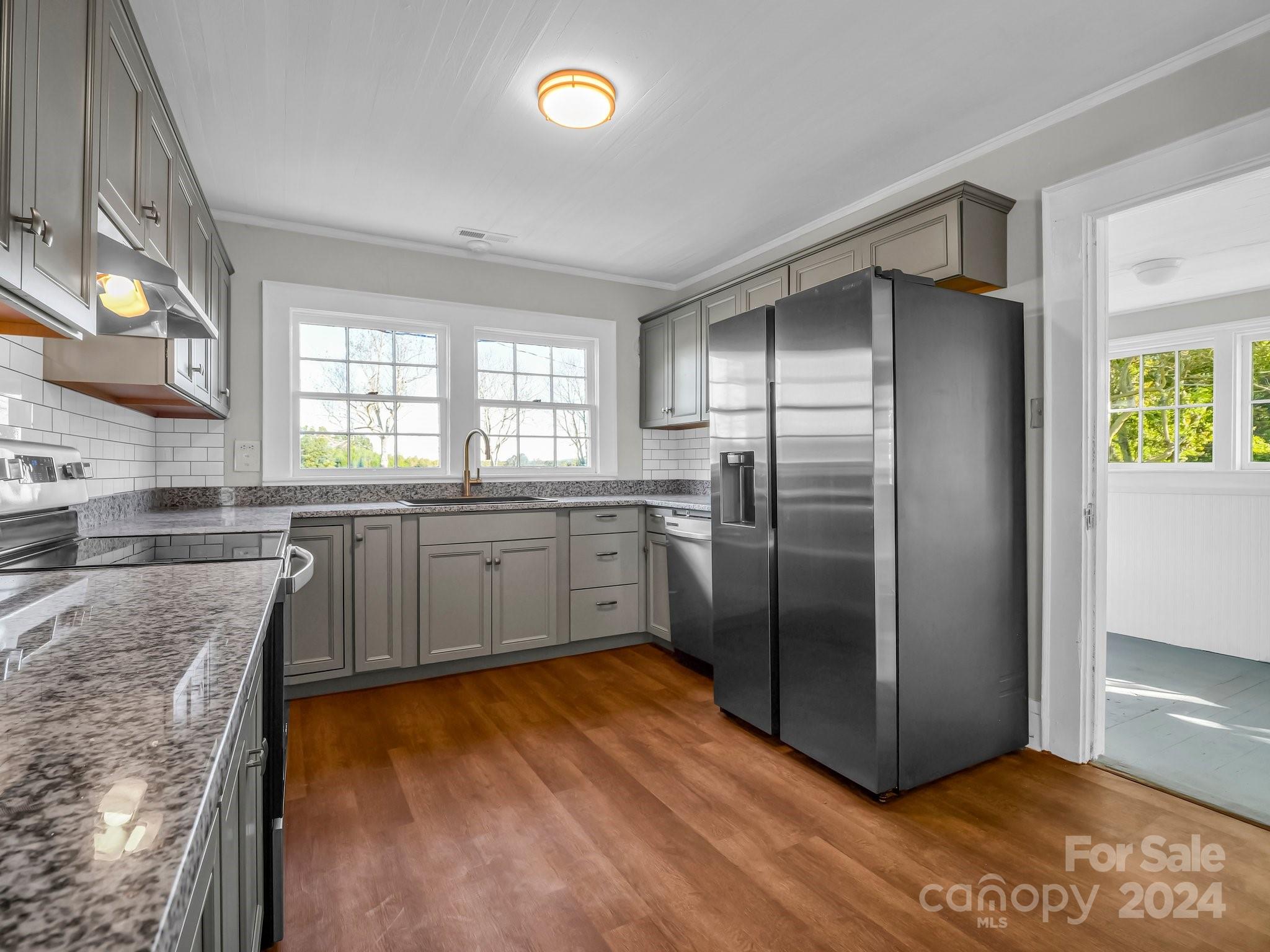574 Cat Square Road Lincolnton, NC 28092 - Photo 14 of 48 a kitchen with stainless steel appliances granite countertop a refrigerator a sink a stove and island