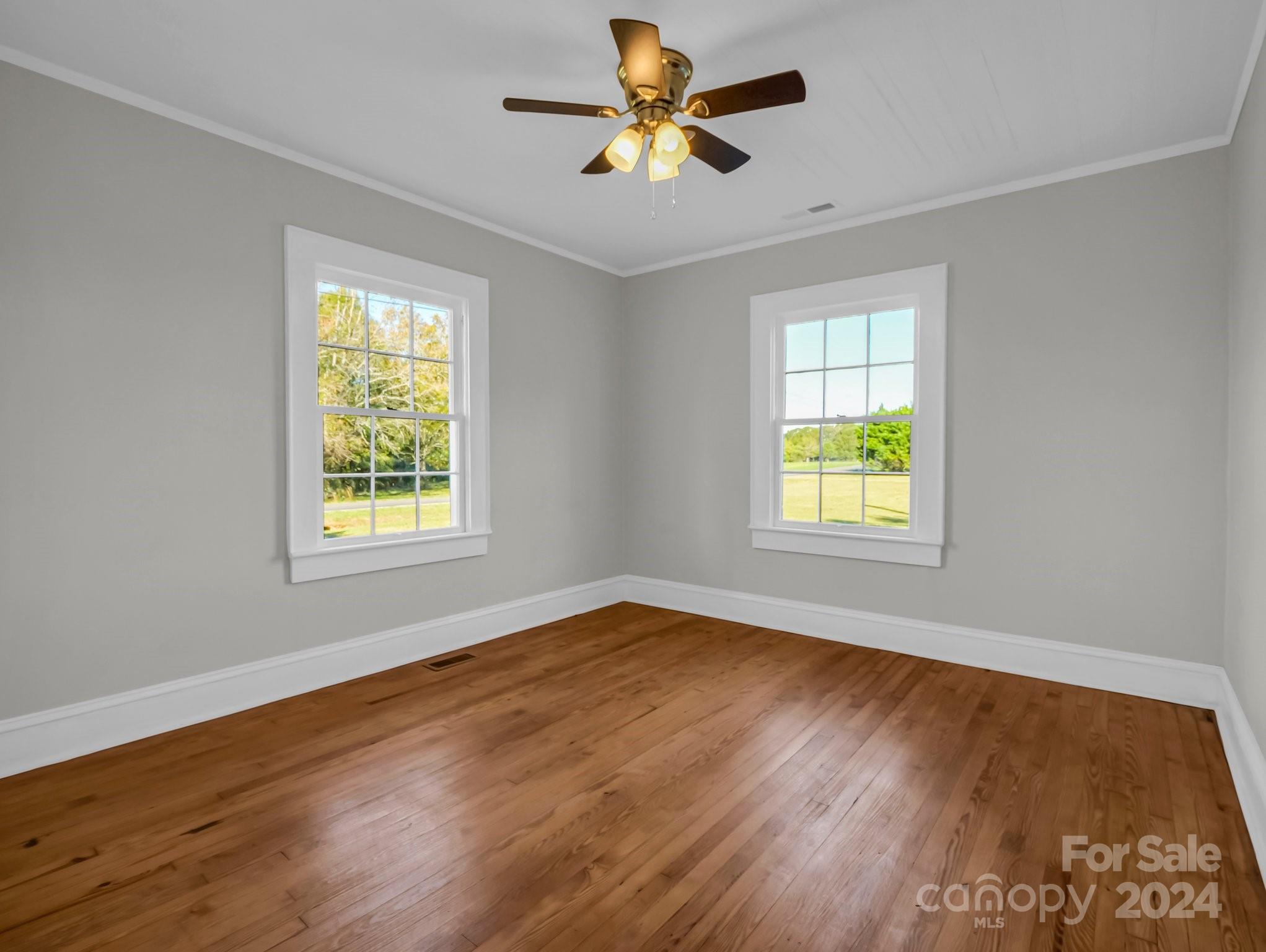 574 Cat Square Road Lincolnton, NC 28092 - Photo 23 of 48 a view of an empty room with window and wooden floor