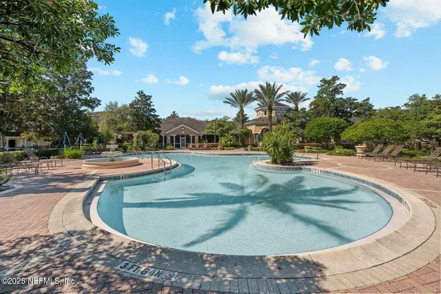 a view of hall way with furniture and a window