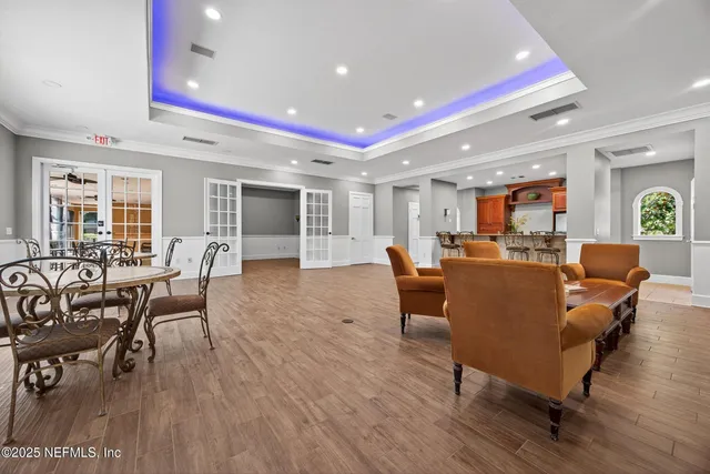 a backyard of a house with a yard and outdoor seating