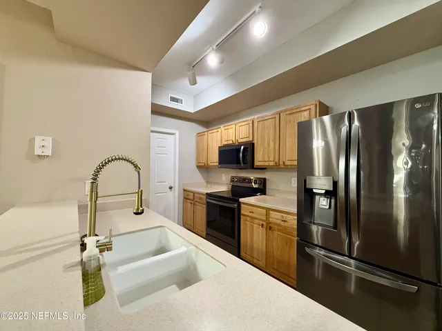 a view of a potted plants from a hallway