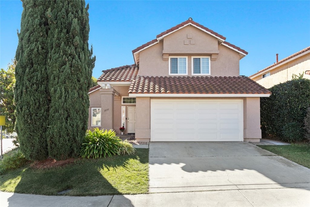 1577 Promontory Ridge Way Vista, CA 92081 - Photo 1 of 1 a front view of a house with a yard and garage
