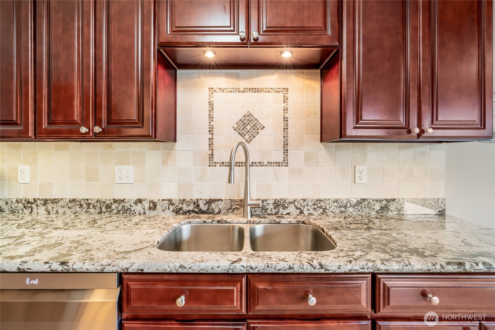 1020 5th Avenue South, Unit 8 Edmonds, WA 98020 - Photo 14 of 28 a kitchen with granite countertop a sink and cabinets