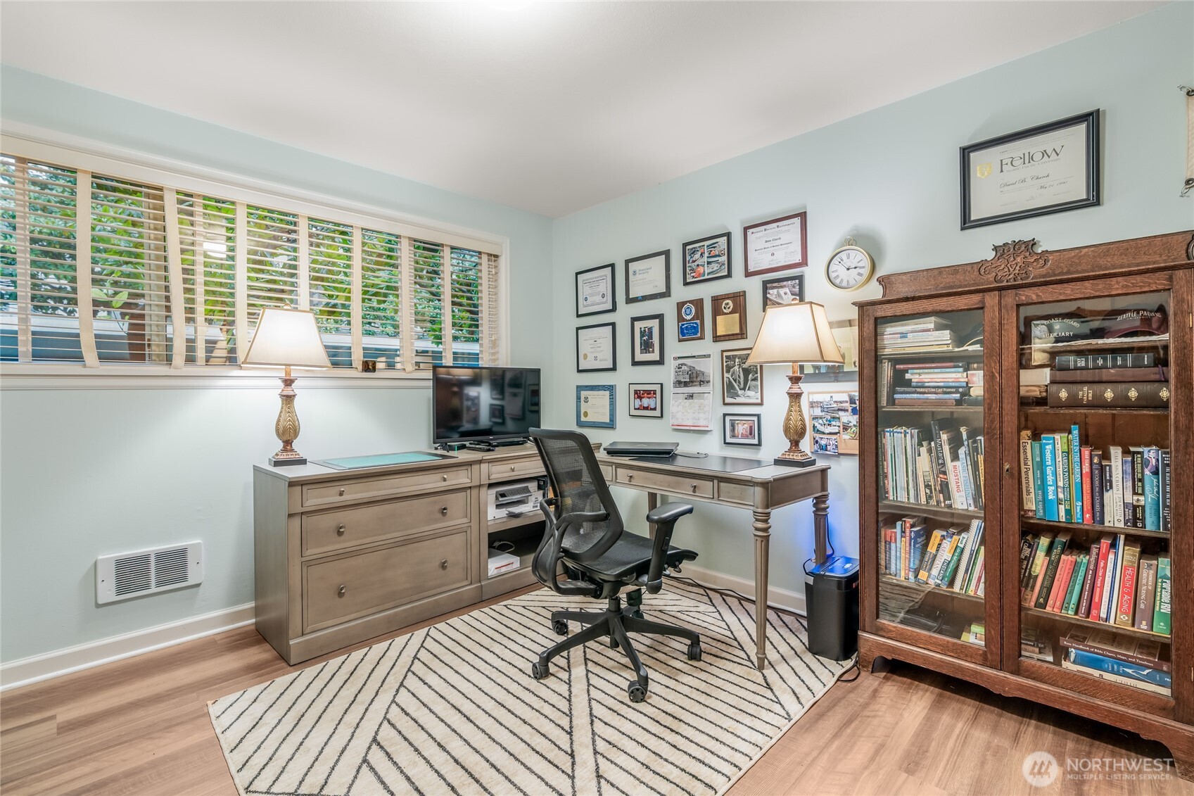 1020 5th Avenue South, Unit 8 Edmonds, WA 98020 - Photo 20 of 28 a view of a workspace with furniture and a bookshelf