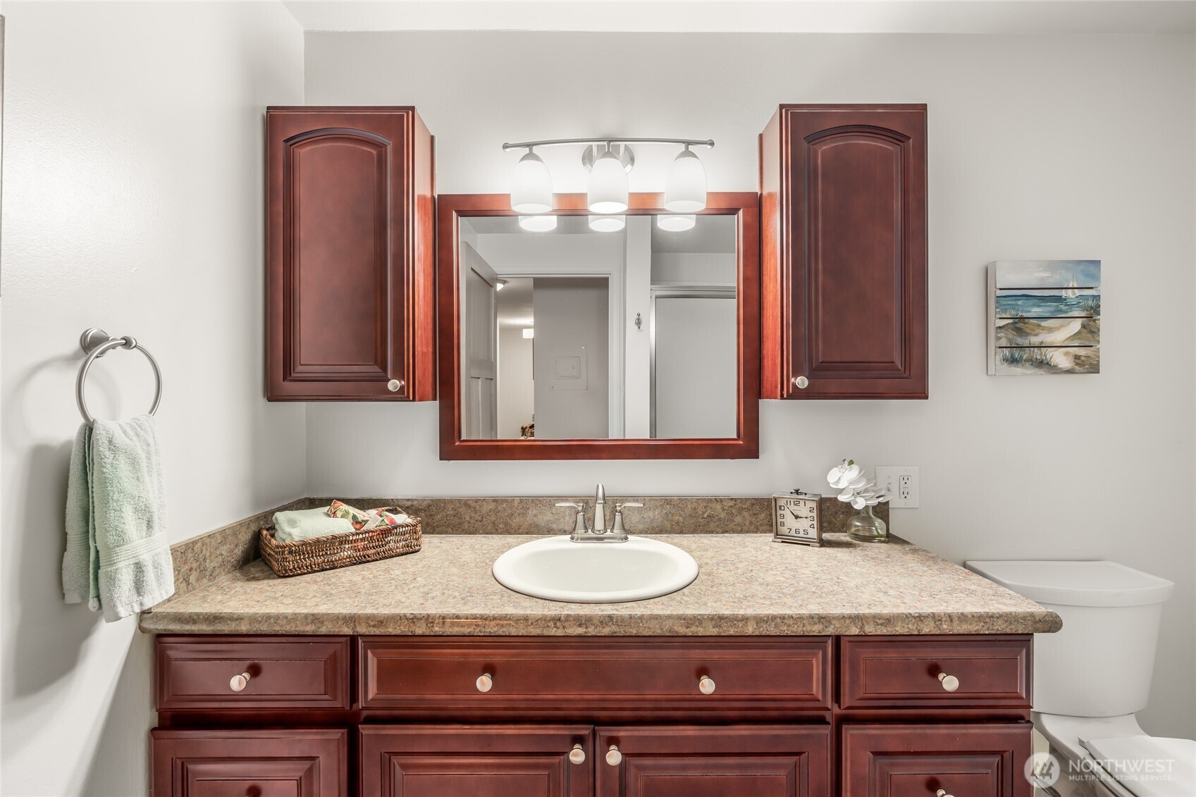 1020 5th Avenue South, Unit 8 Edmonds, WA 98020 - Photo 26 of 28 a bathroom with a granite countertop sink and a mirror