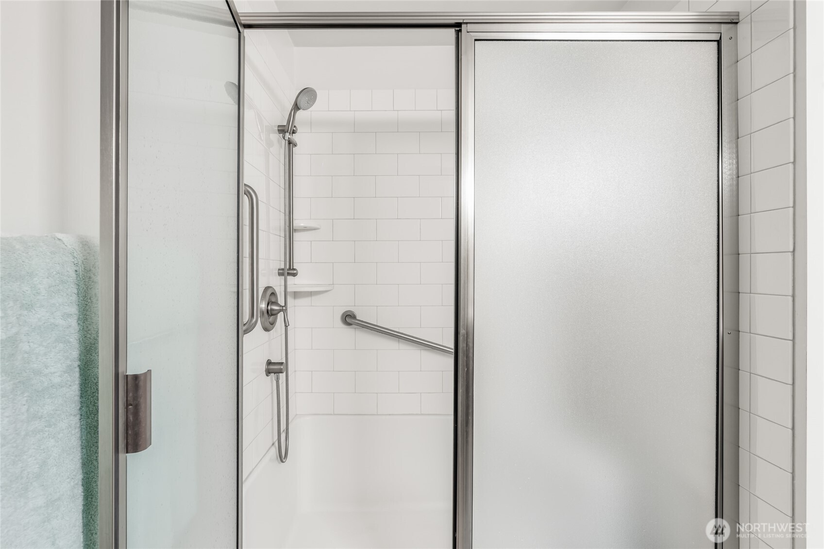 1020 5th Avenue South, Unit 8 Edmonds, WA 98020 - Photo 27 of 28 a bathroom with a glass shower door