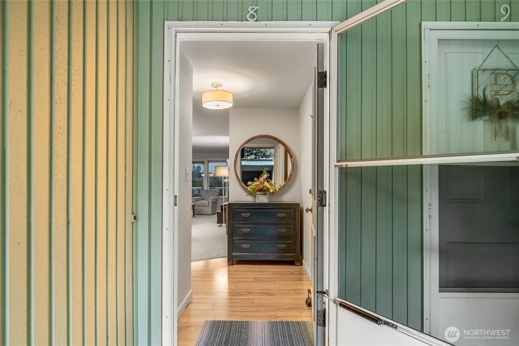 1020 5th Avenue South, Unit 8 Edmonds, WA 98020 - Photo 4 of 28 a view of a hallway with wooden floor
