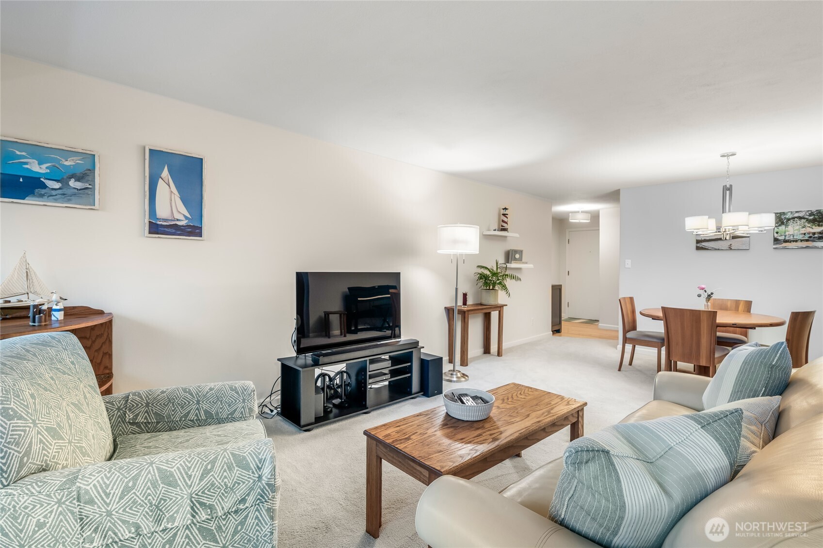 1020 5th Avenue South, Unit 8 Edmonds, WA 98020 - Photo 6 of 28 a living room with furniture and a flat screen tv
