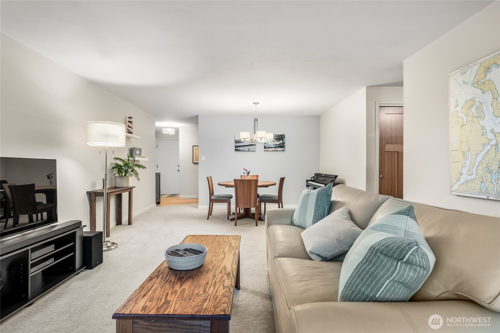 1020 5th Avenue South, Unit 8 Edmonds, WA 98020 - Photo 8 of 28 a living room with furniture and a flat screen tv