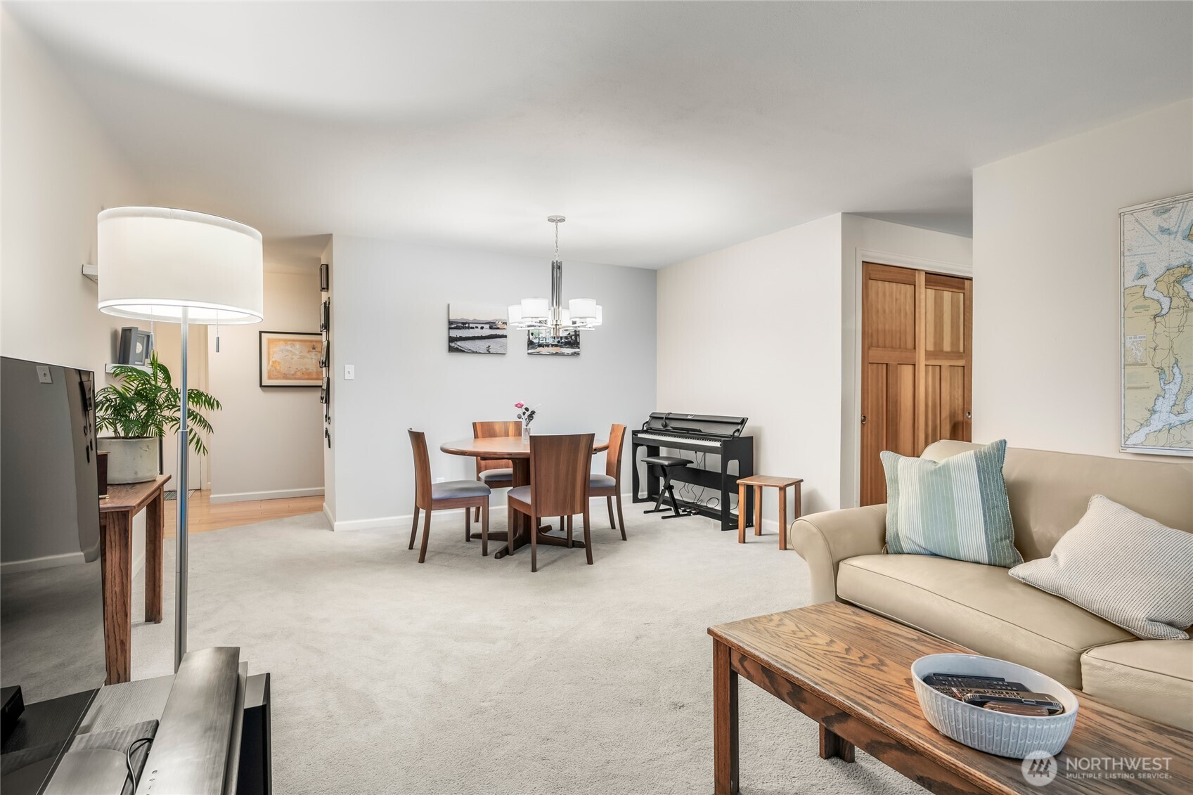 1020 5th Avenue South, Unit 8 Edmonds, WA 98020 - Photo 10 of 28 a living room with furniture a fireplace and a flat screen tv