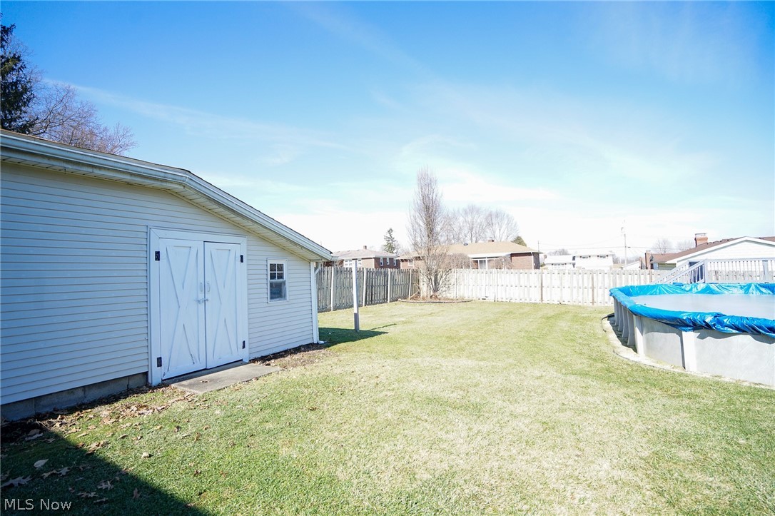 453 Omar Street Struthers, OH 44471 - Photo 9 of 27 Fenced backyard with an outdoor structure