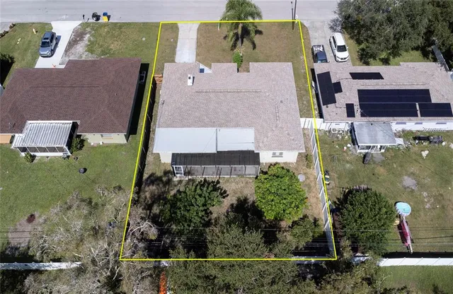 a view of empty room with wooden floor and fireplace