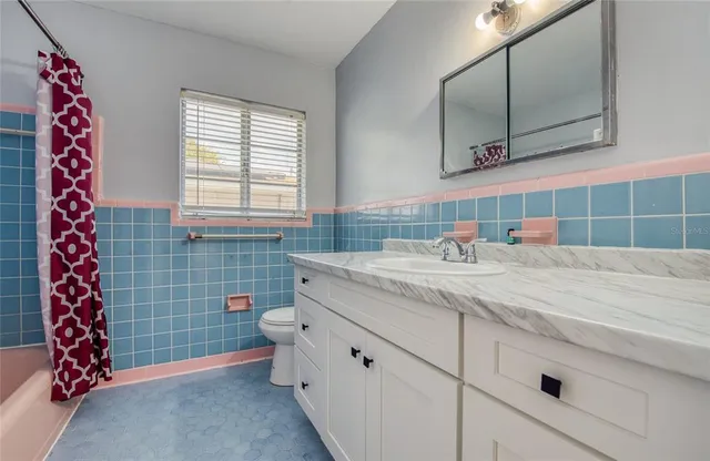 a bathroom with a bathtub and toilet