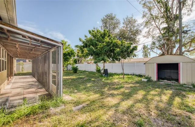 a view of a house with a yard and garage