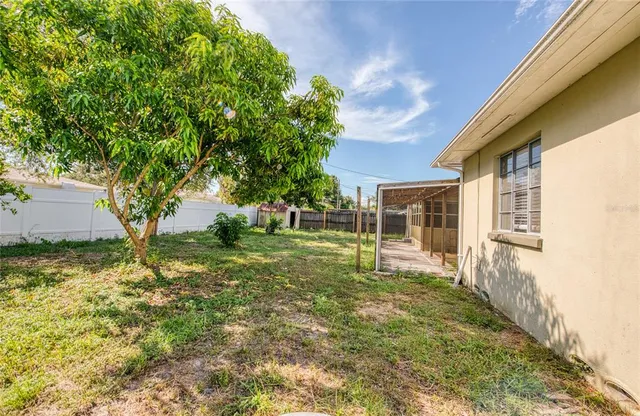 an aerial view of a house with swimming pool
