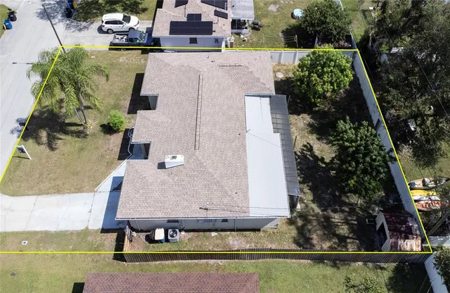 an aerial view of a house with swimming pool