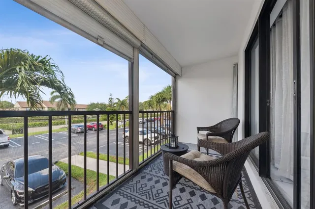 a view of a balcony with furniture