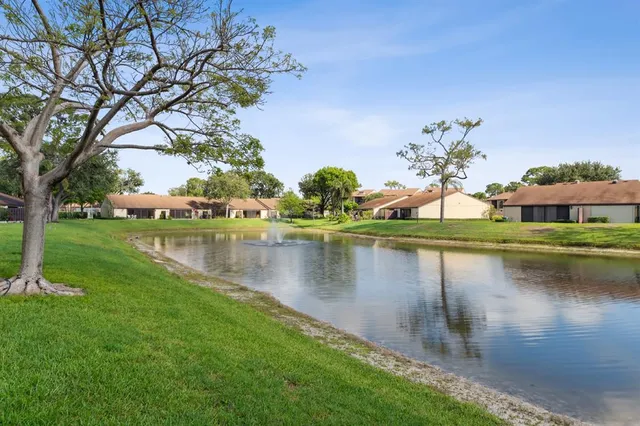 a view of a lake with a big yard