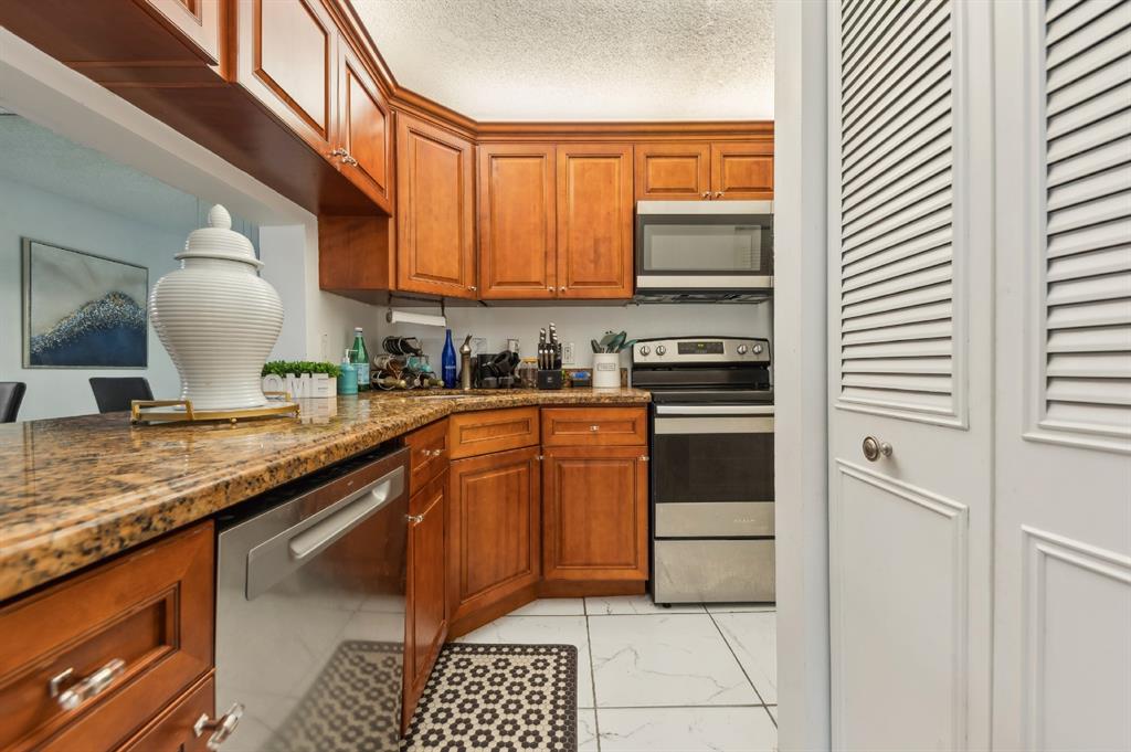 608 Sea Pine Way, Unit D2 Greenacres, FL 33415 - Photo 5 of 13 a kitchen with a sink cabinets and appliances