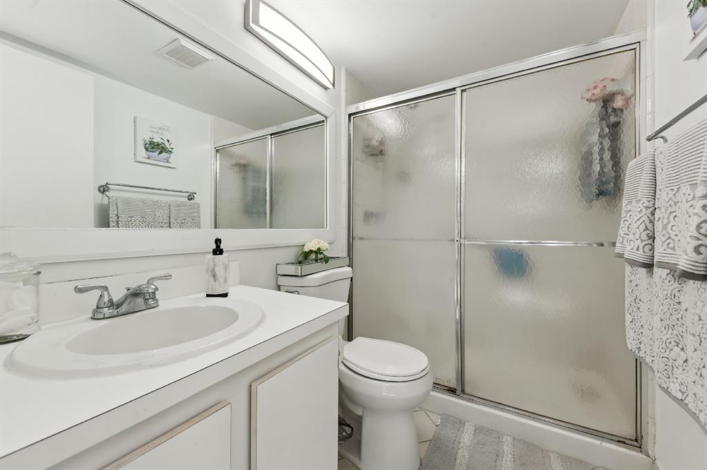 608 Sea Pine Way, Unit D2 Greenacres, FL 33415 - Photo 8 of 13 a bathroom with a sink toilet and shower