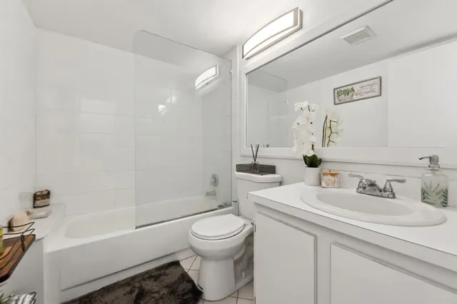 a bathroom with a sink a toilet and a bathtub